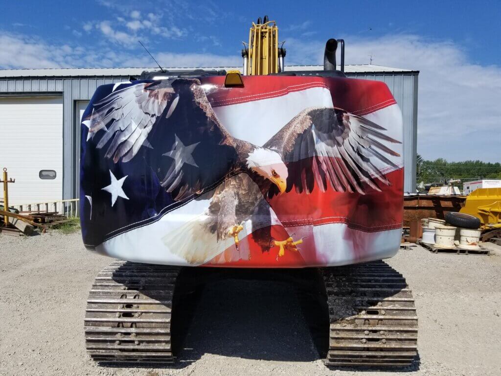 Brand Ink Patriotic Eagle Design on an Excavator